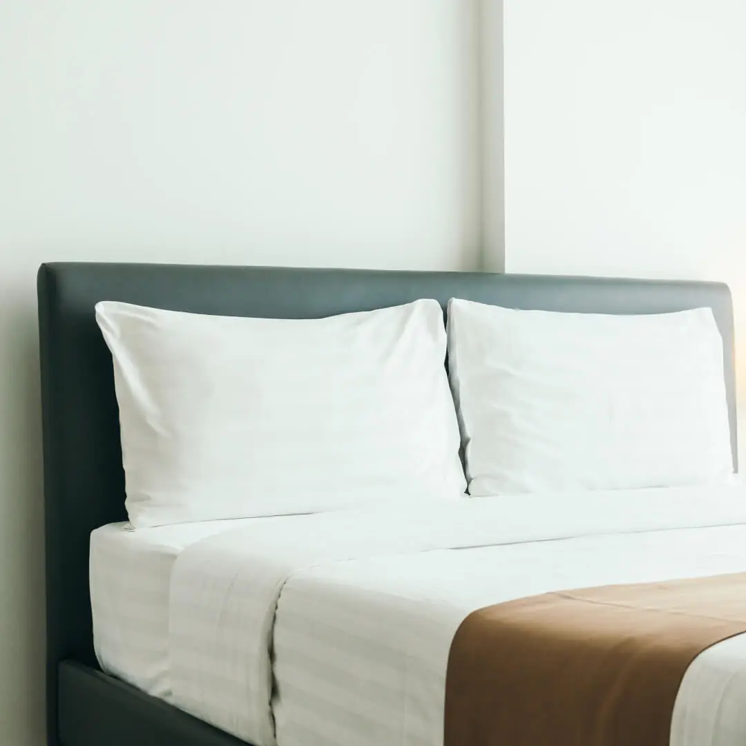 A soft hotel bed with clean sheets